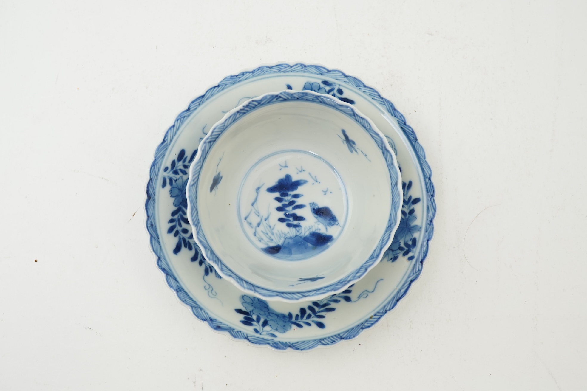 A Chinese blue and white tea bowl and saucer, Kangxi period